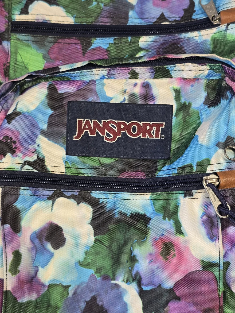 JanSport Floral Watercolor Backpack with Faux Leather Base